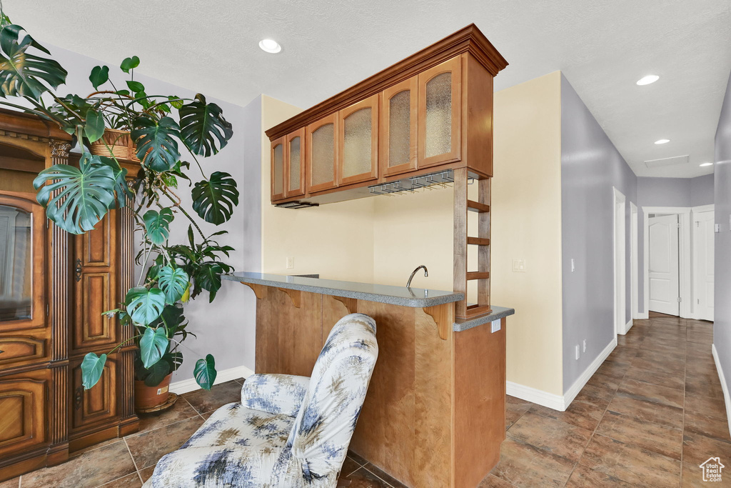 Interior space with baseboards and recessed lighting