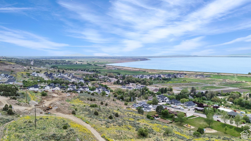 Drone / aerial view featuring a water view and a residential view