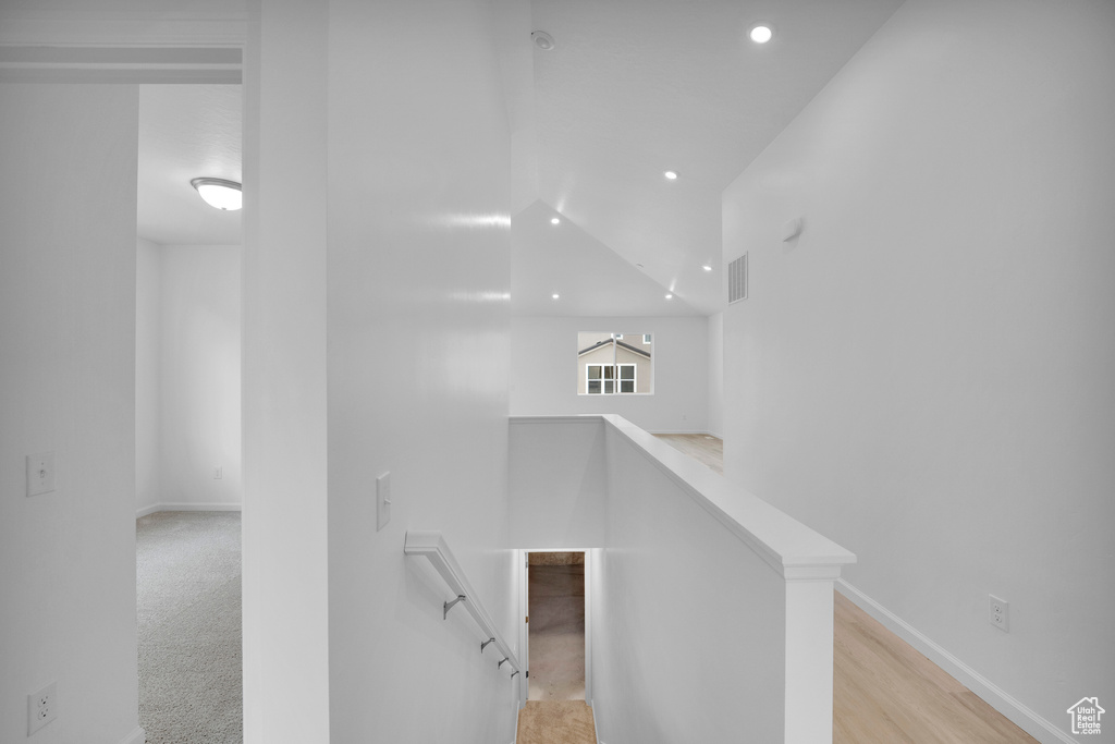 Staircase featuring recessed lighting and baseboards