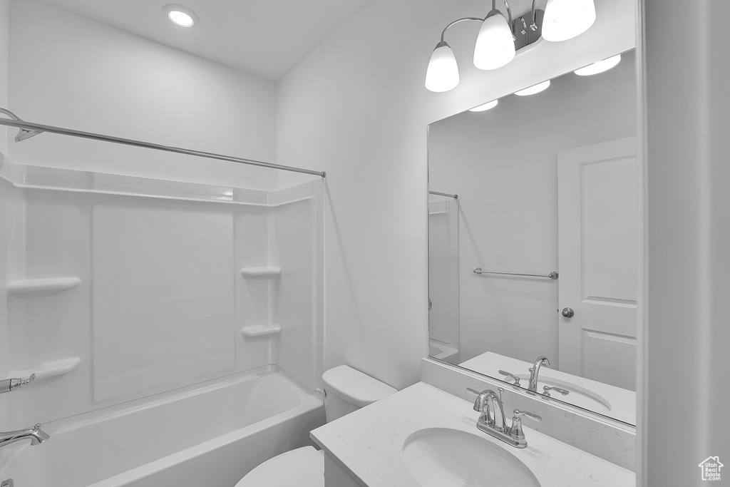 Full bath featuring toilet, shower / bath combination, vanity, and recessed lighting