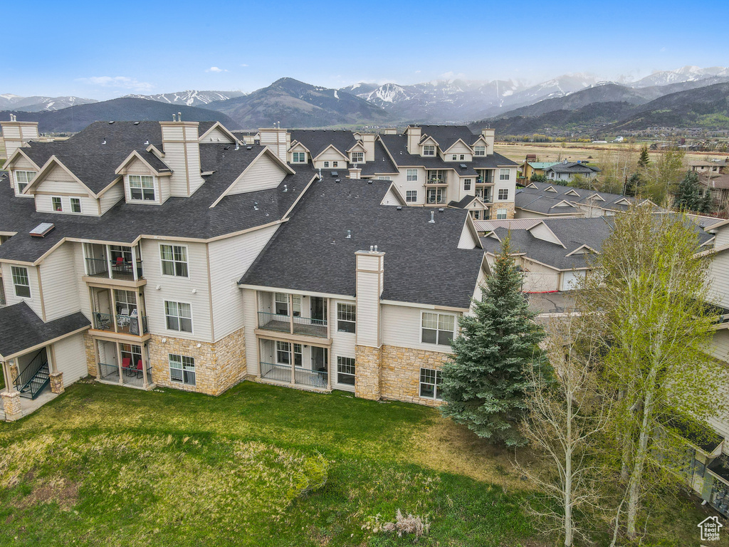 Drone / aerial view with a mountain view and a residential view