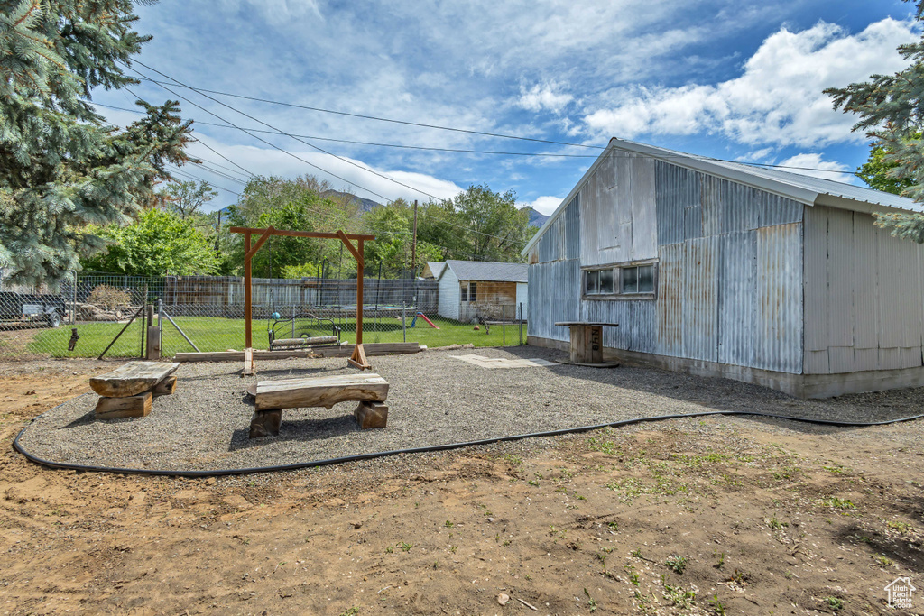 View of outdoor structure featuring an outbuilding