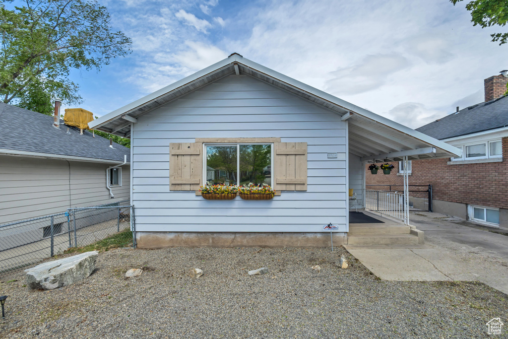 View of front facade with fence