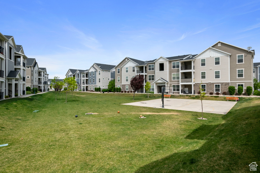 View of property\'s community with a residential view and a lawn
