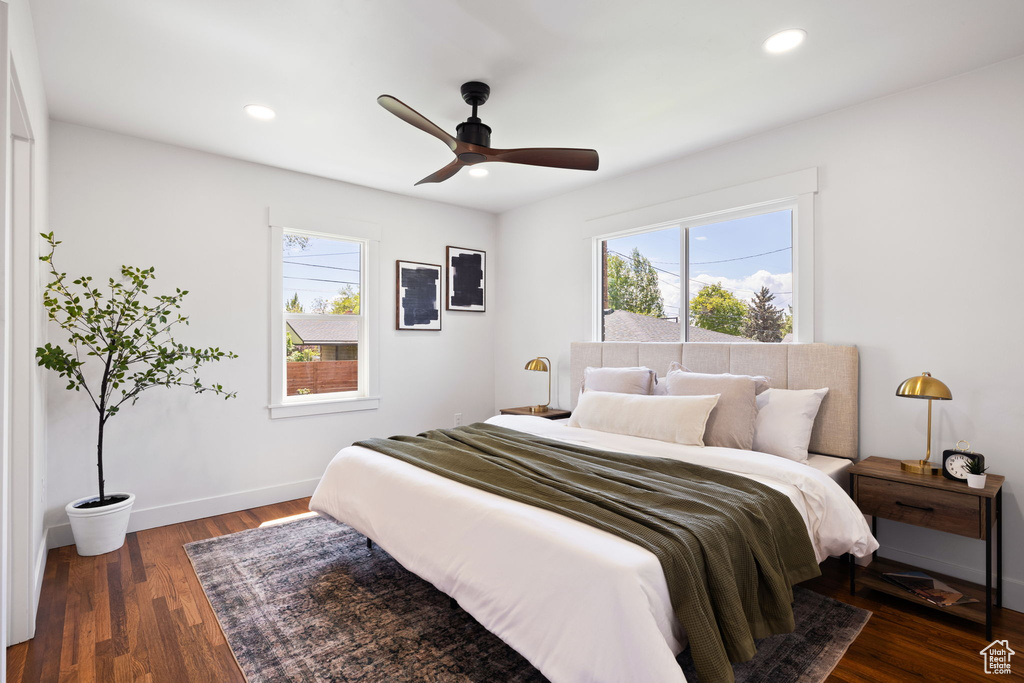 Bedroom with wood finished floors, recessed lighting, baseboards, and ceiling fan