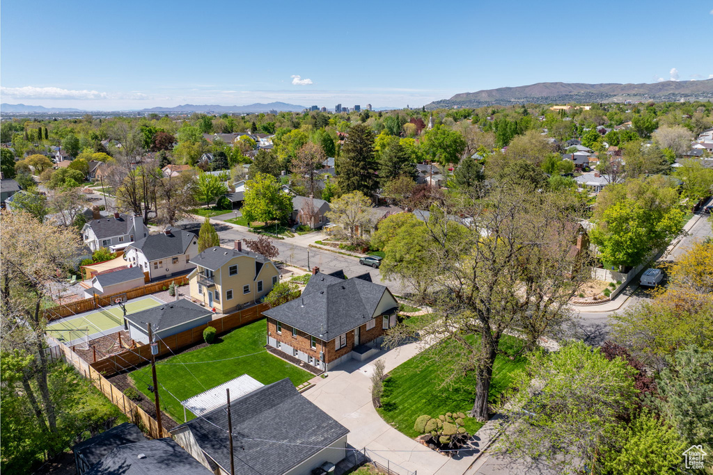 Aerial view of residential area featuring a mountainous background