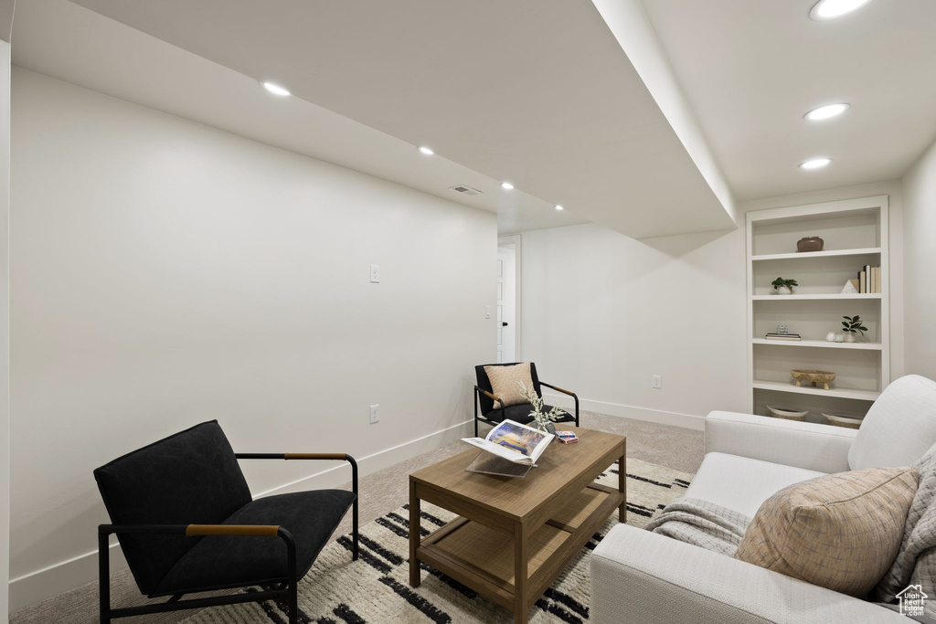 Living room featuring recessed lighting, light colored carpet, and baseboards