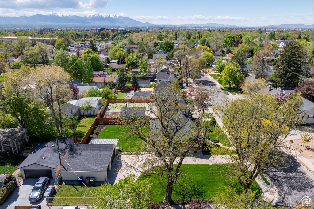Aerial view of residential area featuring a mountain backdrop