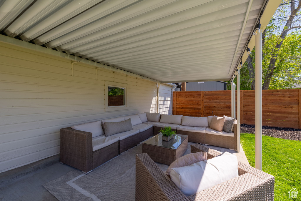 View of patio / terrace with an outdoor hangout area and fence