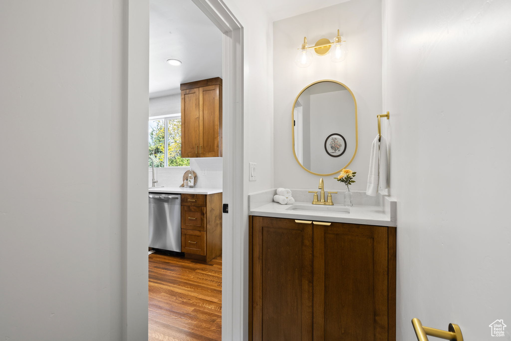 Bathroom with wood finished floors and vanity