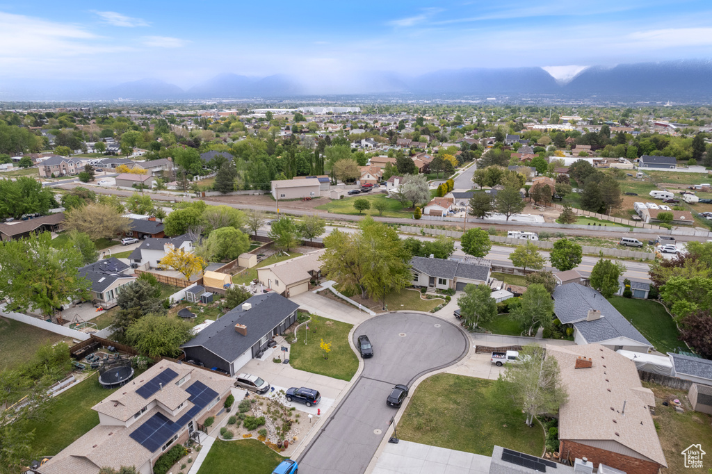 Aerial view of residential area featuring mountains