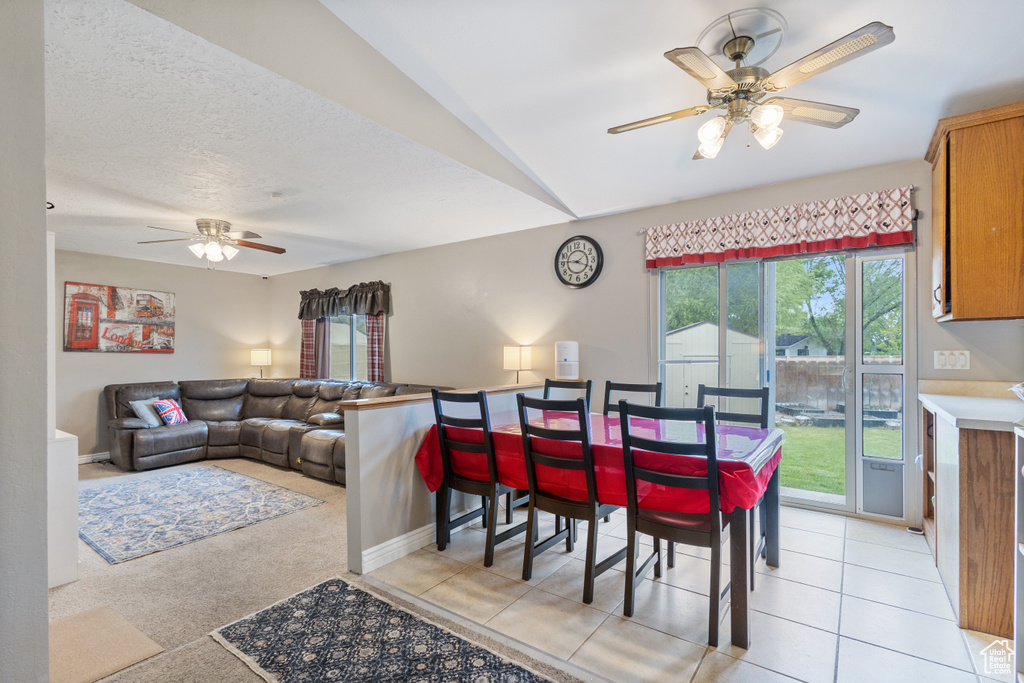 Dining area with ceiling fan and baseboards