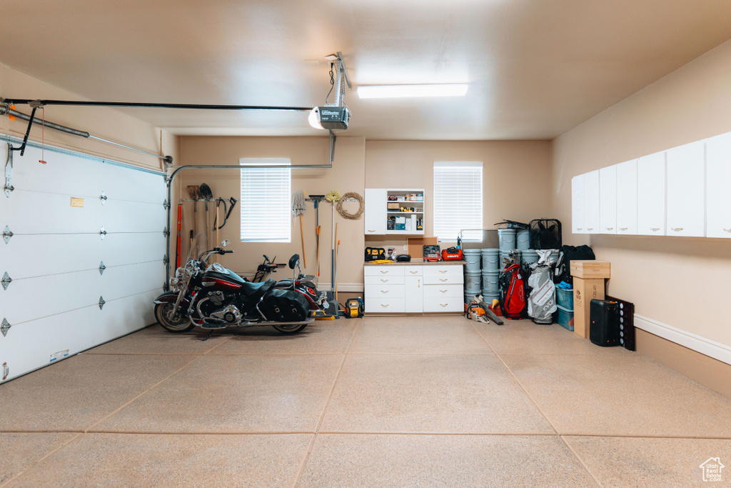 Garage featuring a garage door opener