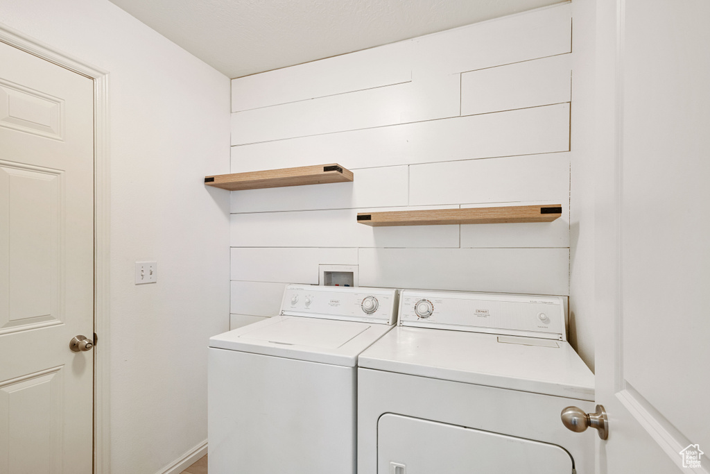 Laundry area with washing machine and clothes dryer