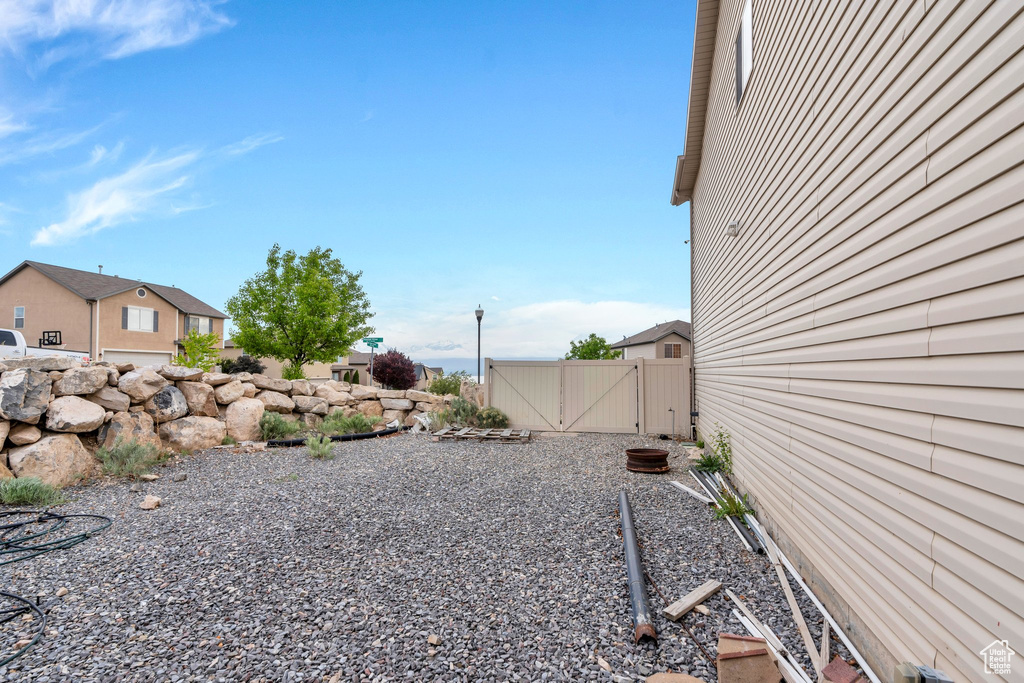 View of yard with a gate