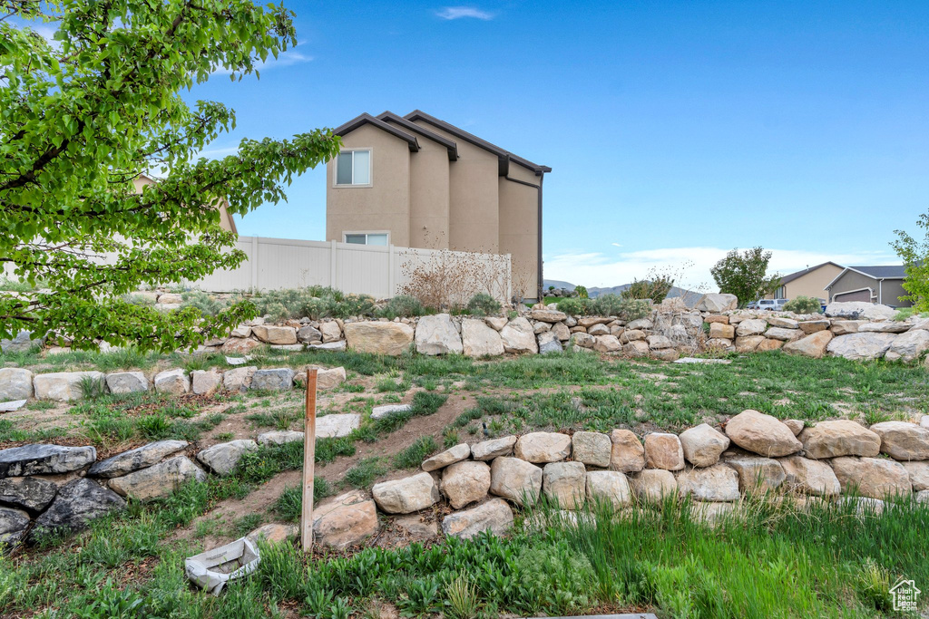 View of yard with fence