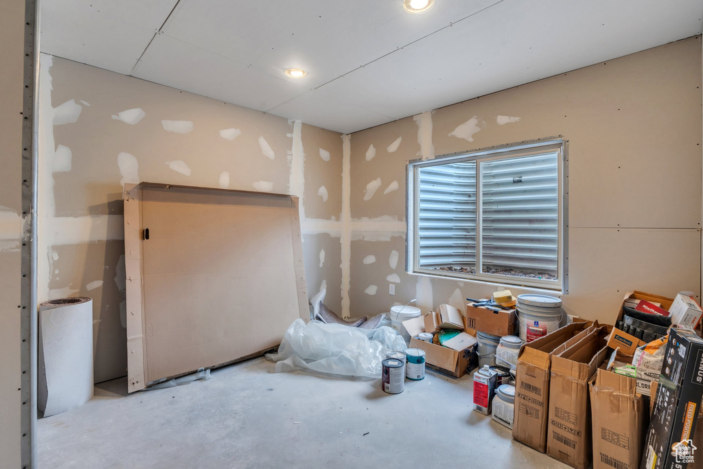 Misc room featuring unfinished concrete flooring