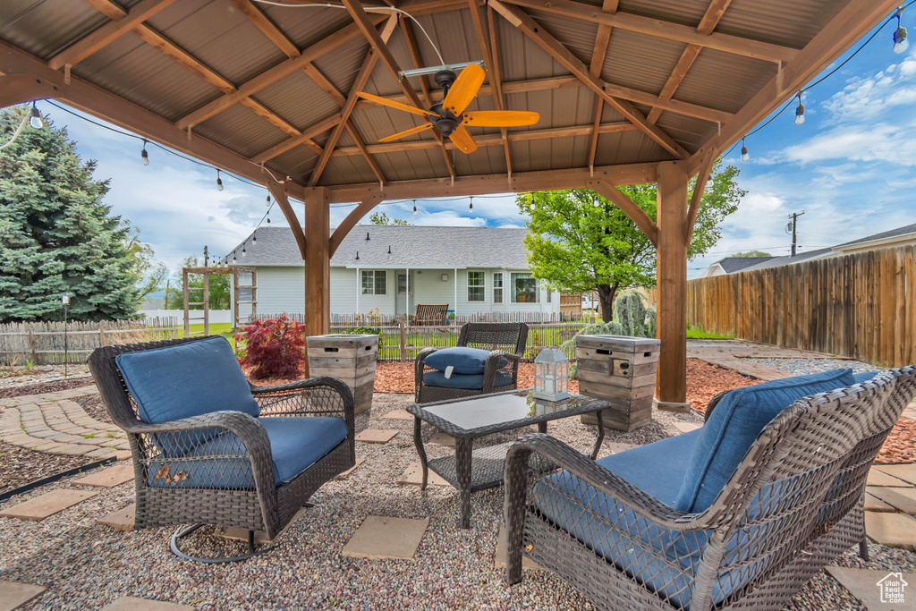 View of patio with a gazebo and a fenced backyard