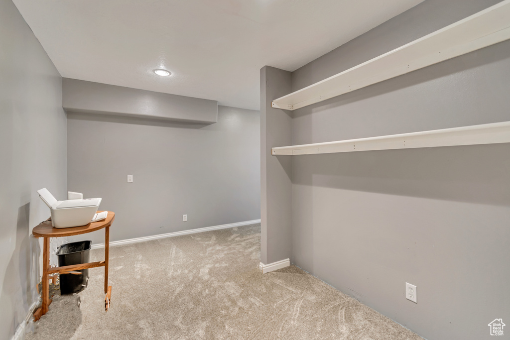 Finished below grade area featuring carpet and baseboards