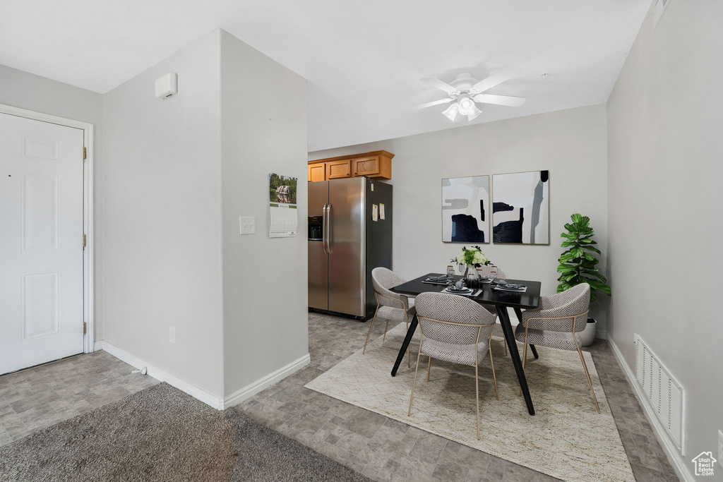 Dining area featuring baseboards, ceiling fan, and an office area