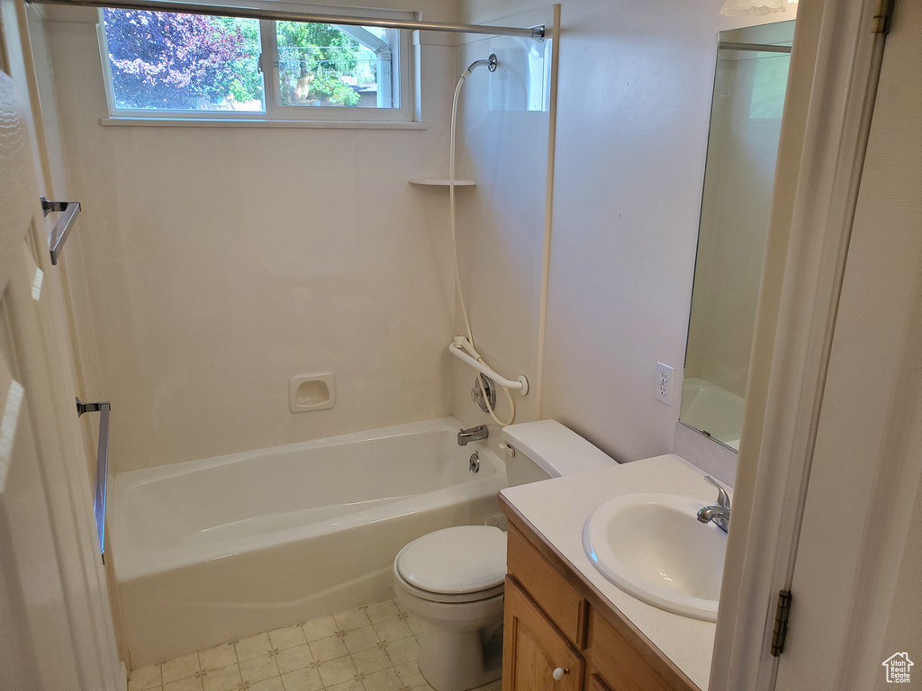 Full bathroom with toilet, shower / tub combination, and vanity
