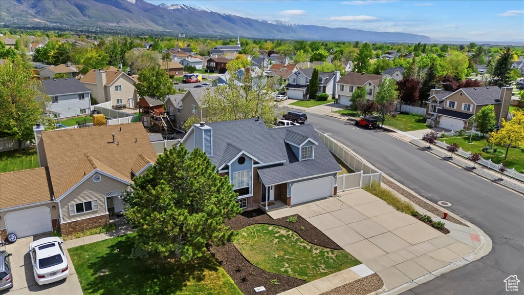 Aerial view of residential area with a mountainous background
