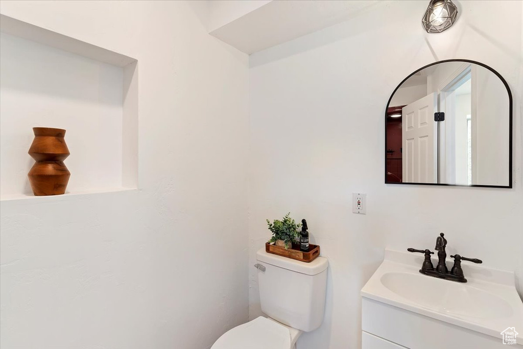 Bathroom with toilet and vanity