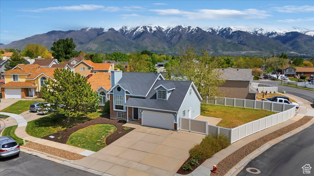 Aerial view of residential area featuring mountains