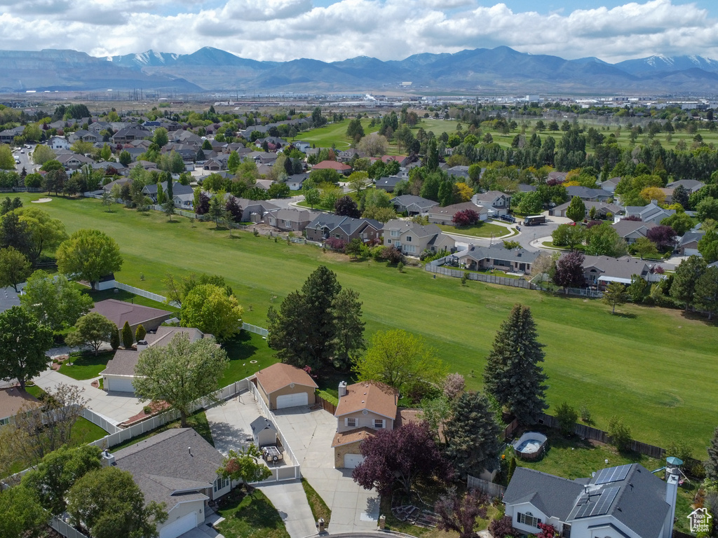 Aerial view of residential area featuring a mountainous background