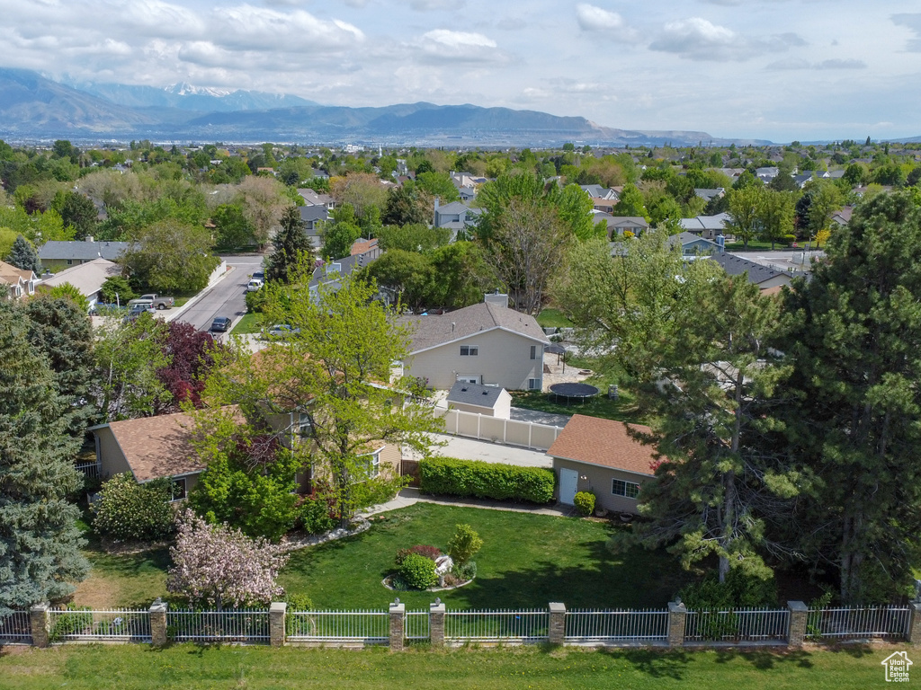 Aerial perspective of suburban area with a mountainous background