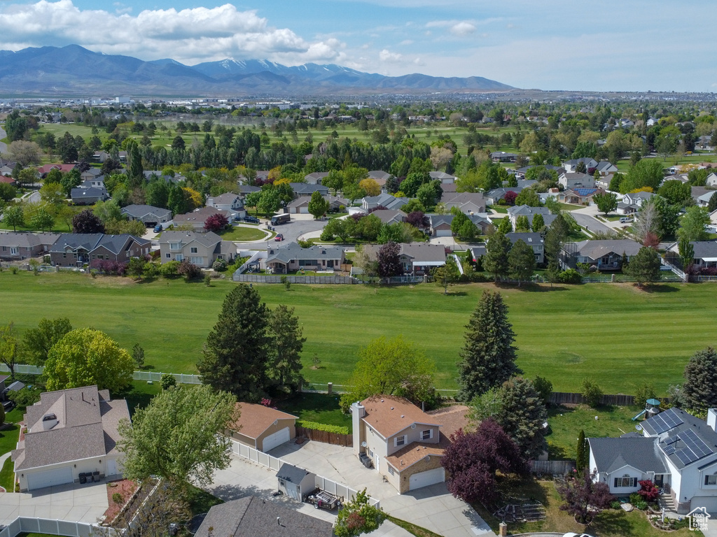 Aerial perspective of suburban area featuring a mountainous background