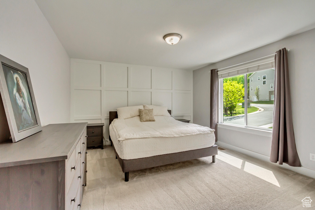 Bedroom with light colored carpet