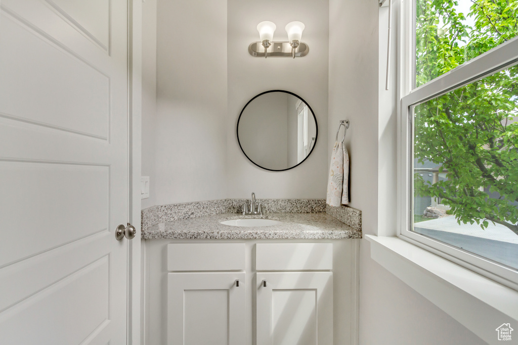 Bathroom featuring vanity and plenty of natural light