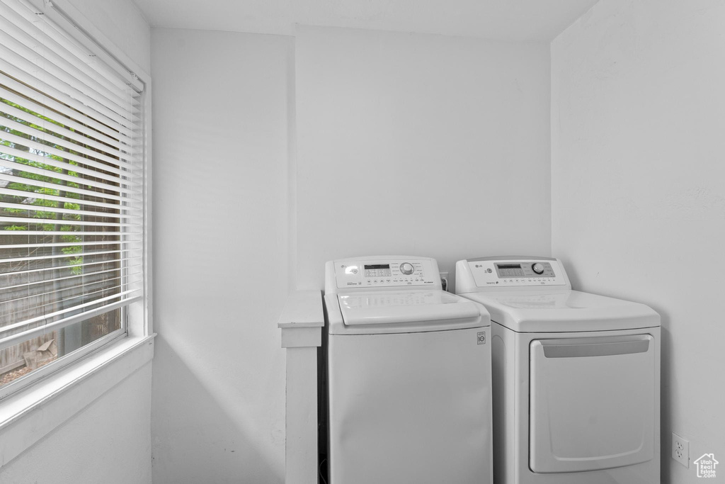 Laundry room with washing machine and dryer