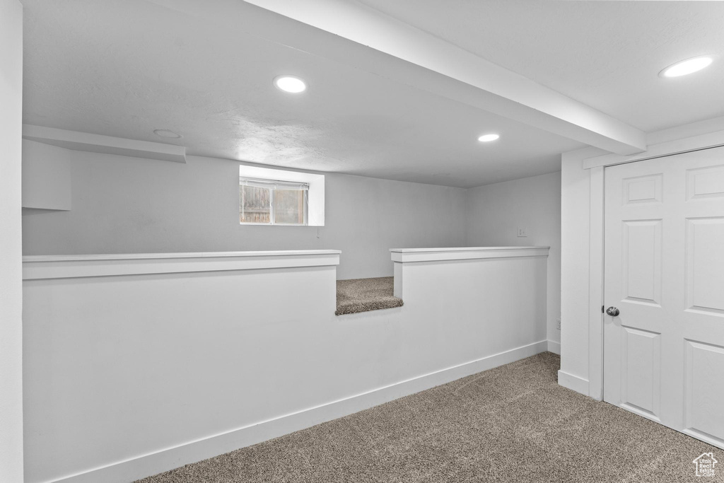 Below grade area featuring recessed lighting, carpet flooring, and baseboards