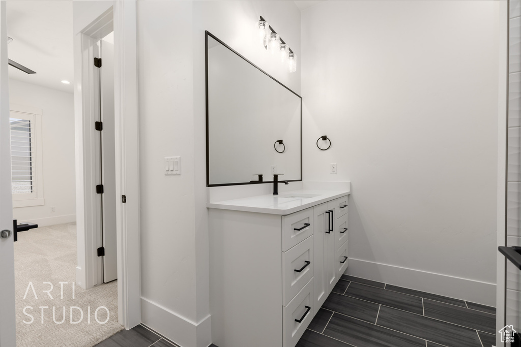Bathroom with baseboards and vanity