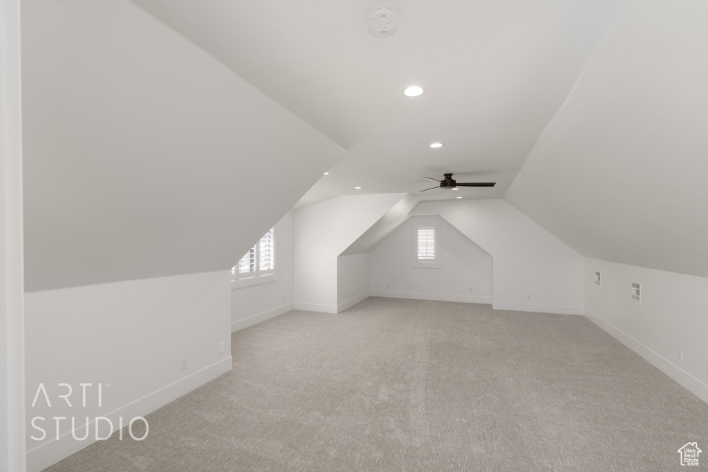 Additional living space featuring recessed lighting, light colored carpet, baseboards, vaulted ceiling, and ceiling fan