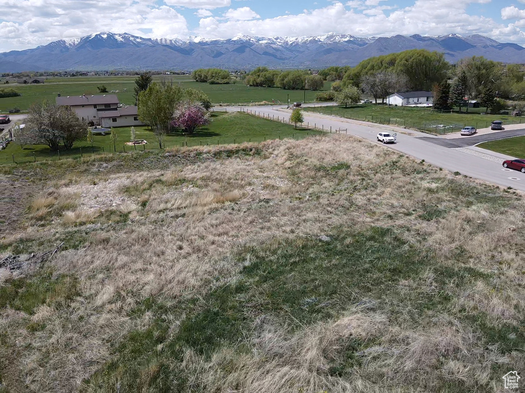View of mountain backdrop featuring rural landscape