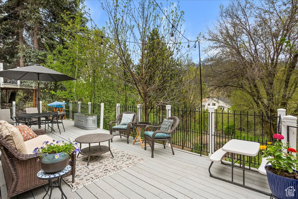 Wooden terrace featuring outdoor dining space