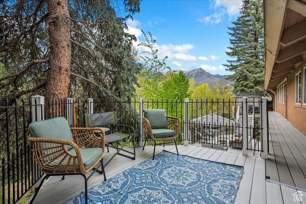 Wooden deck featuring a mountain view