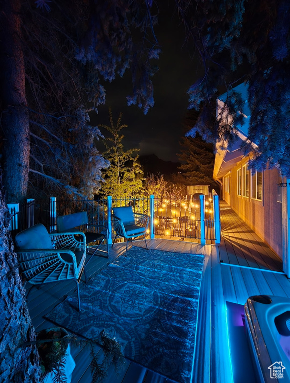 Patio at twilight with a deck