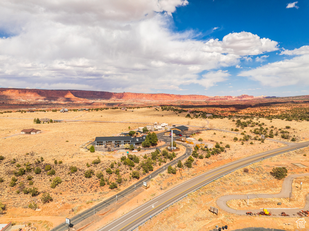 Aerial view of sparsely populated area featuring a desert landscape and mountains