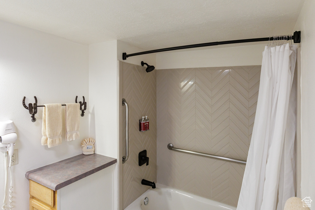 Full bathroom with shower / tub combo with curtain