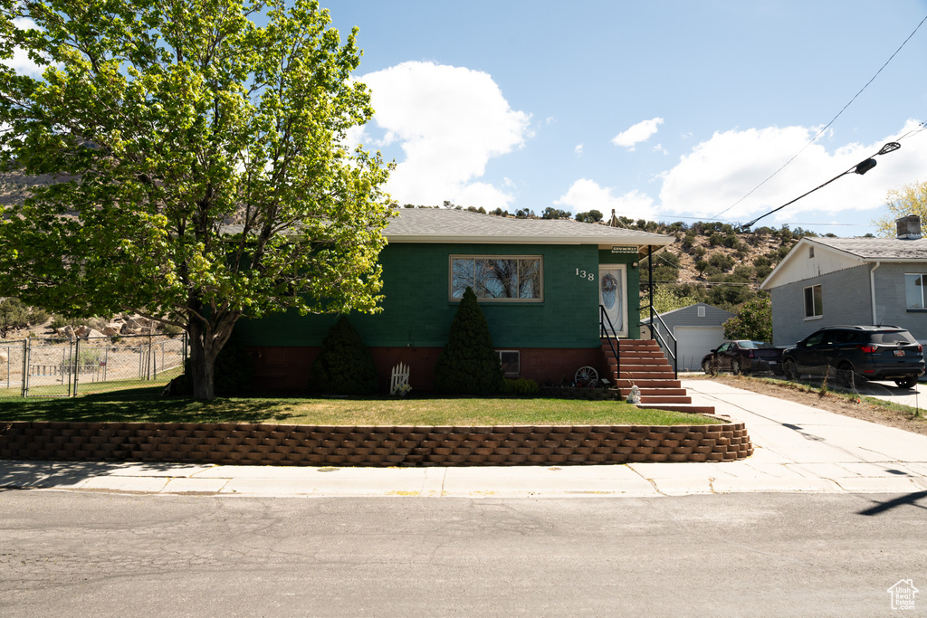 Bungalow-style house with an outbuilding