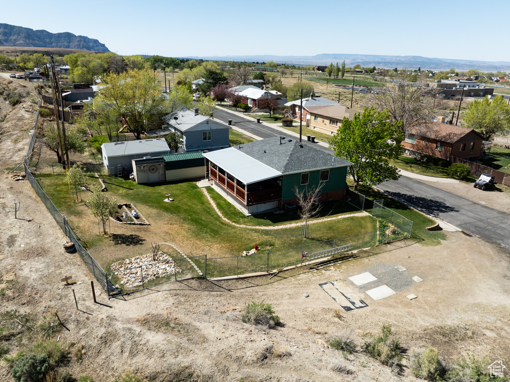 Aerial perspective of suburban area featuring a mountainous background