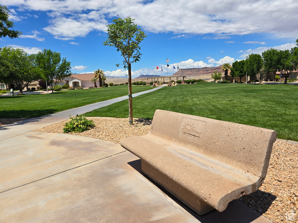 View of property\'s community with a yard