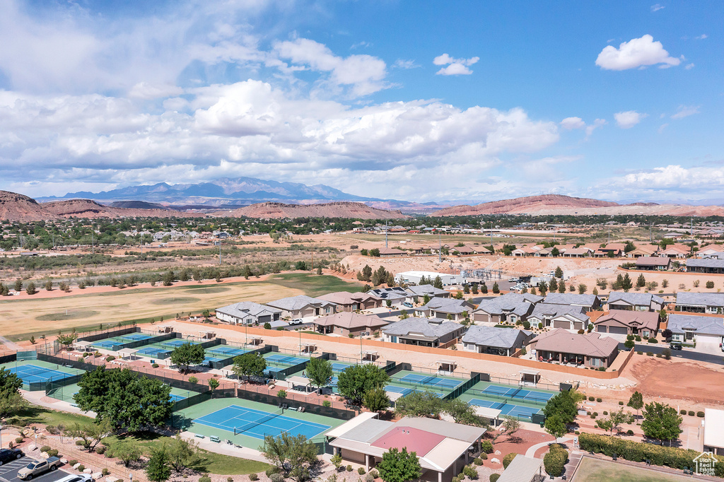Aerial view of residential area featuring a mountainous background