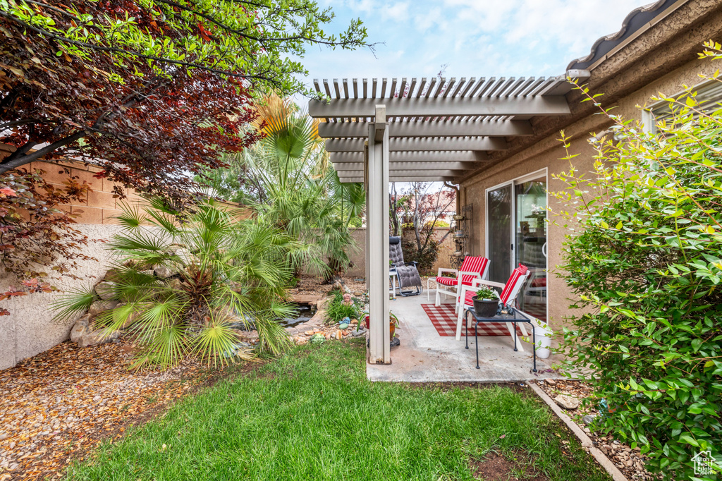 View of yard featuring a pergola and a patio area