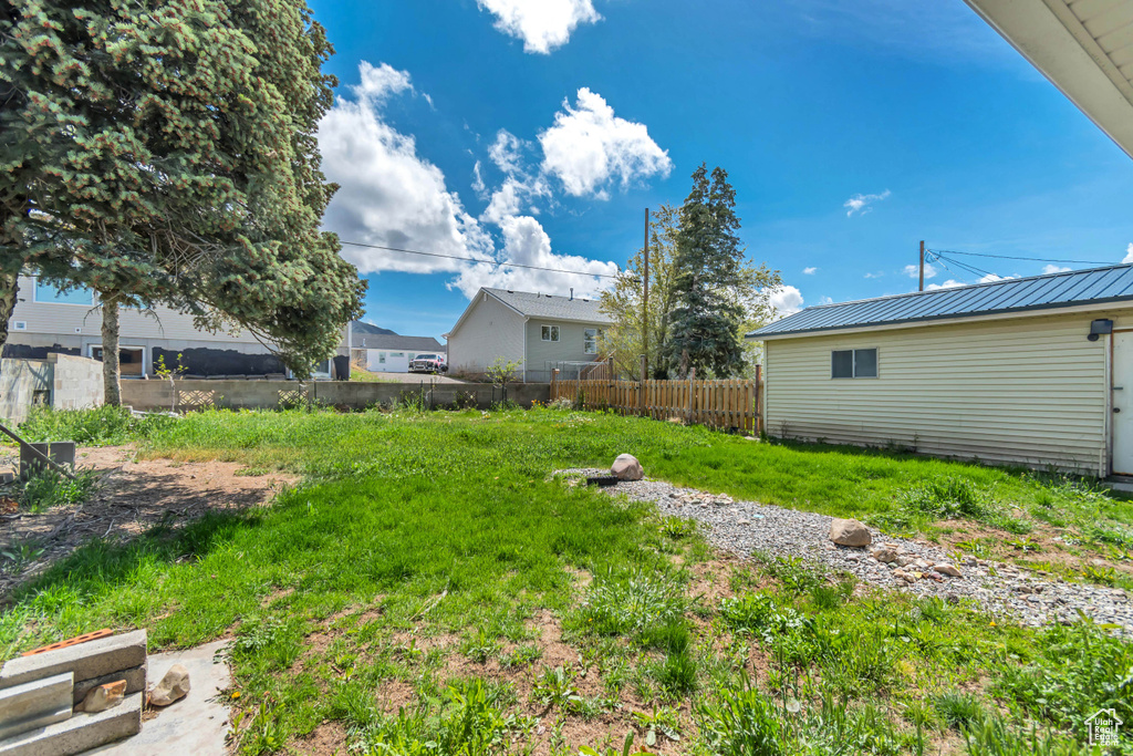 View of yard featuring fence