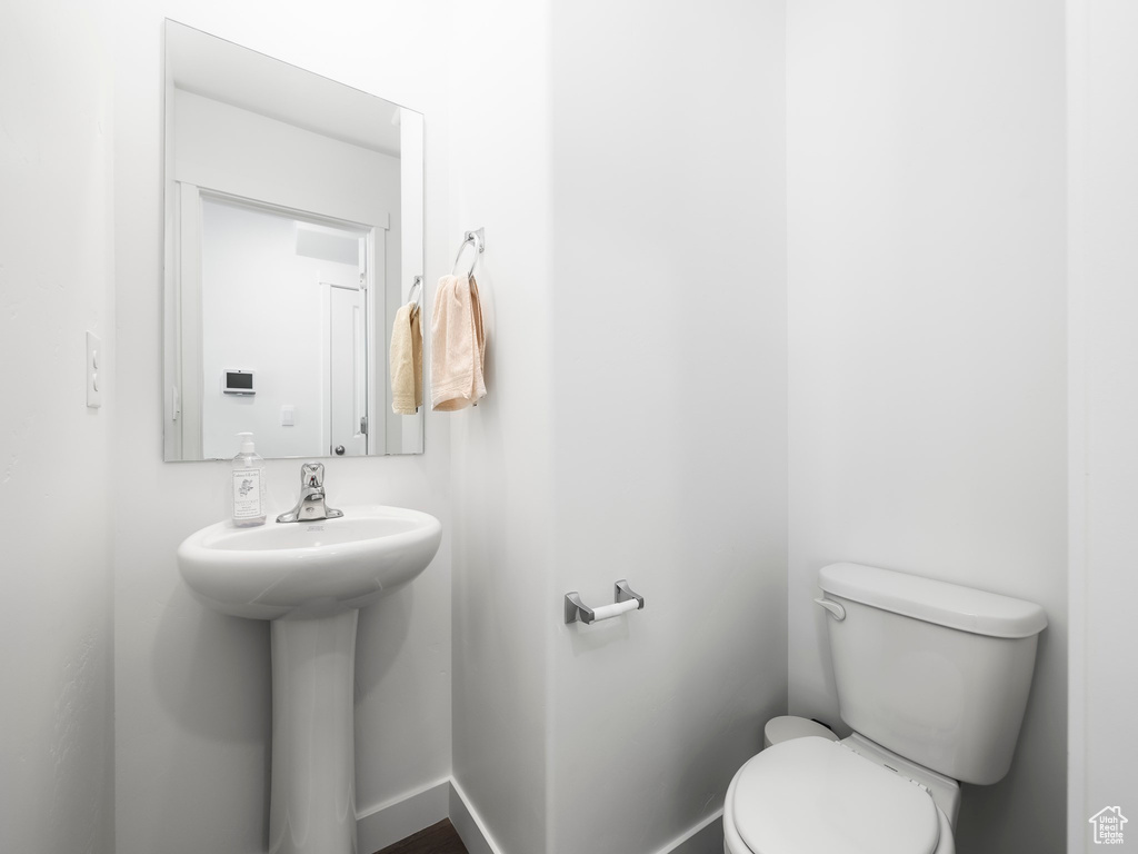 Bathroom featuring toilet and a sink